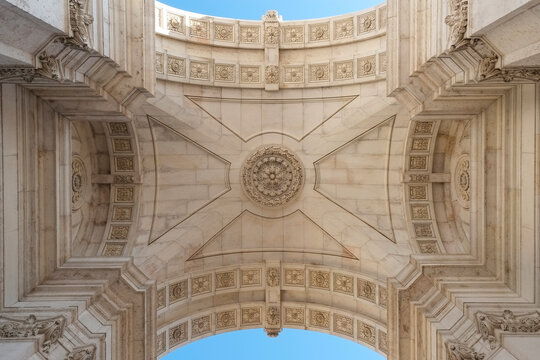 Symmetrical stone arch ceiling with carved geometric detail