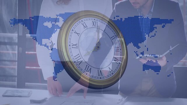 Animated clock rotating, causing two men leaning at design table reviewing project plans