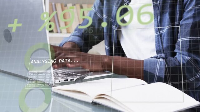 Man resting hands then typing on laptop, animating green numbers overlay, analyzing data for tech