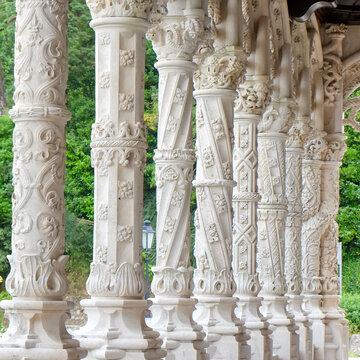 Ornate carved stone columns in a historic cloister