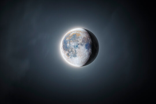 Detailed Waning Moon in Night Sky - Visible Craters and Texture