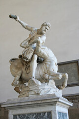 Fototapeta premium Hercules and the Centaur Nessus Statue in Loggia dei Lanzi displayed on a pedestal in Florence, Italy.