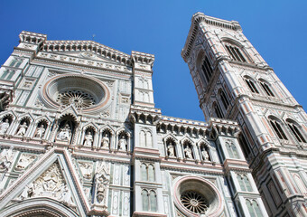 Fototapeta premium Front Facade and Giotto's Bell Tower of Florence Cathedral in Italy clear blue sky