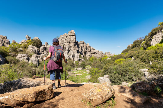 Senior hiker woman looking at the karst landscape of El Torcal de Antequera, Spain.
