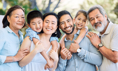 Obraz premium Outdoor, generations or big family with piggyback for portrait, connection or bonding for relationship. Asian people, grandparents or parents with kids for support, weekend fun or love for happiness