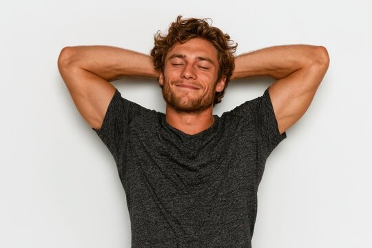 relaxed man resting with hands behind head