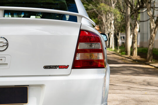 White Chevrolet Astra GSI rear taillight and badge close up, Classic hot hatch rear end details outdoors