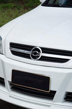 White Chevrolet Astra front end badge close up, Classic hot hatch external detail outdoors
