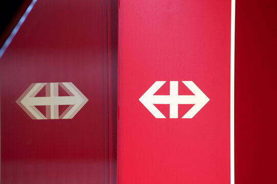 SBB / CFF / FFS (Swiss Federal Railways company) symbol reflected on glass at train station in Lugano