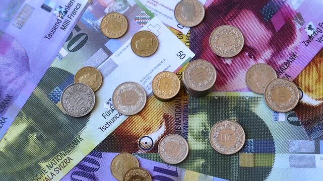 Switzerland, Swiss franc paper money and coins, financing and commodity exchange, trade. Swiss currency as a background for your design