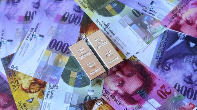 A silver bar, white metal against a backdrop of Swiss flag, as a concept for the sales market. A silver bar as a background for your design