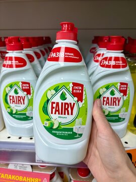 03.05.2026 Ukraine, Kharkov Woman's Hand Holding a Bottle of Fairy Sensitive Dishwashing Liquid in a Supermarket.