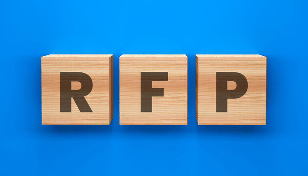 RFP Cubes on Blue Backdrop: Three wooden blocks, each bearing a letter, spell out RFP, laid out against a vibrant blue backdrop