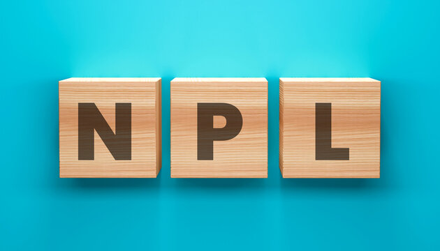 NPL Concept: Three wooden blocks, neatly arranged, spell out the acronym NPL against a simple backdrop, illustrating a clear concept.