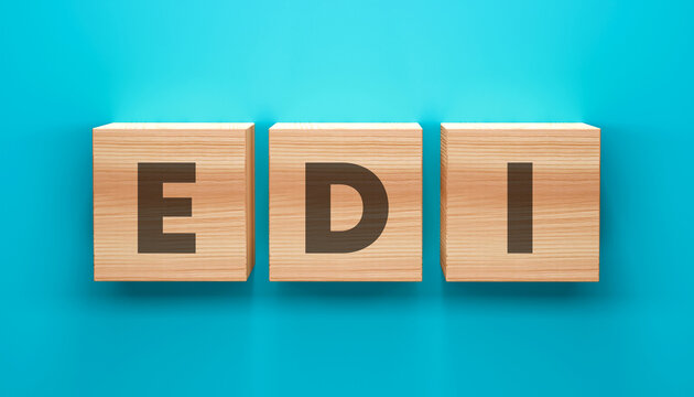 EDI Wooden Blocks: A conceptual representation featuring three wooden blocks, each displaying a letter to form the acronym EDI, artfully arranged on a striking blue backdrop.