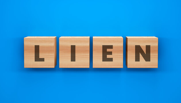 Lien blocks on blue background: Four wooden blocks spelling out the word LIEN, set against a vibrant blue background, symbolizing a financial claim or right.