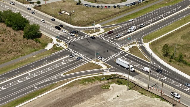 Aerial view of the intersection of Foundry Lane and a multi-lane highway with vehicles and road markings World Golf Village, Florida, United States.