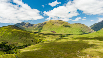 Naklejka premium Aerial view of the open mountain landscapes and valleys around Killary Fjord in Connemara, Ireland. This image shows the surrounding countryside from above rather than the fjord itself.