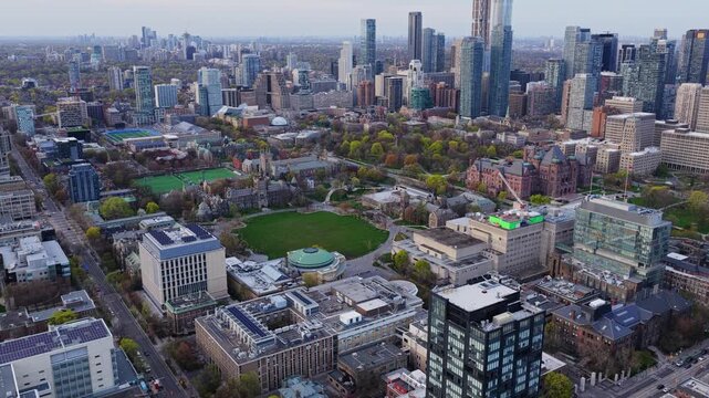 University of Toronto St. George campus showing Convocation Hall and Queen's Park with modern skyscrapers and architectural contrast of historic building in Toronto
