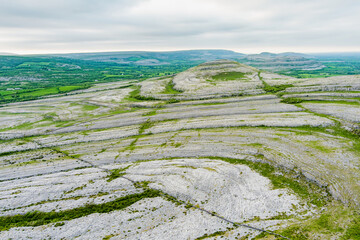 Naklejka premium Aerial view of Burren National Park in County Clare, Ireland. Dramatic limestone karst landscape on the Wild Atlantic Way with green fields and wild countryside.