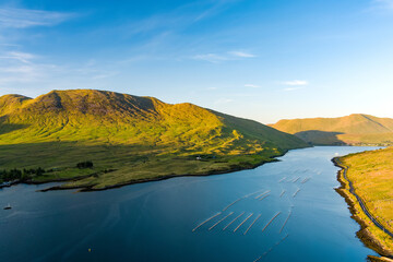 Naklejka premium Aerial view of Killary Fjord near Leenane on the Galway Mayo border, Ireland. Irelands only fjord winds through the dramatic Connemara and Mayo mountain landscape.