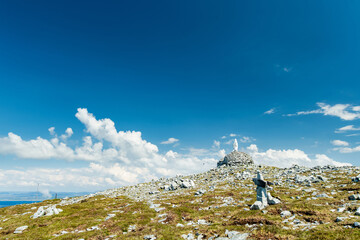 Naklejka premium Statue of the Virgin Mary on Minaun Heights, Achill Island, County Mayo, Ireland. Rocky mountain summit with sweeping Atlantic views on the Wild Atlantic Way.