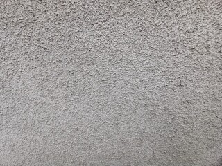 photographie en très gros plan d'un mur recouvert de crépi pour texture en fond d'écran © AURELIE SUARES