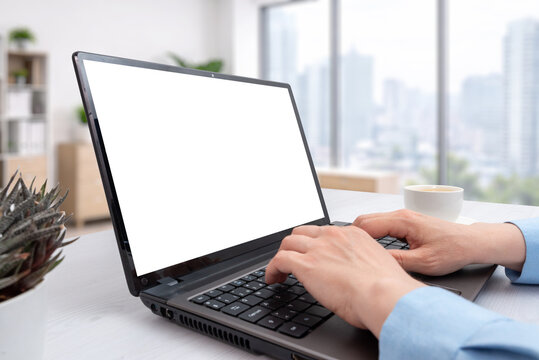 Modern laptop mockup in bright office with city background, suitable for software presentation, online business, education or technology advertising projects