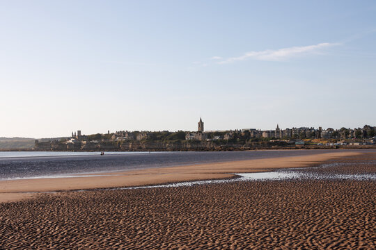 Wide flat West Sands beach on sunny evening, St Andrews, Scotland