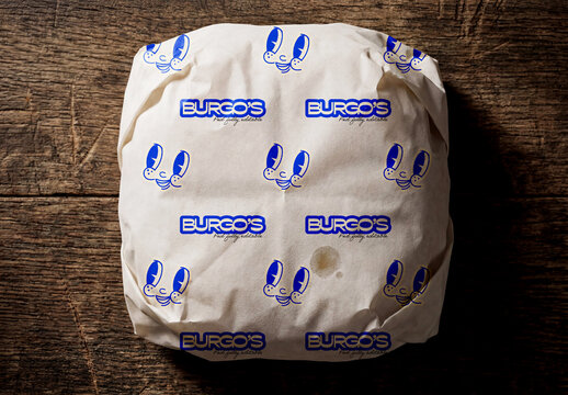 Wrapped Burger Packaging Mockup on Rustic Wooden Surface