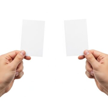 A person holding two blank white cards in their hands