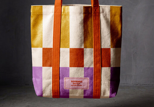Hand Holding Canvas Tote Bag in Studio Scene Mockup