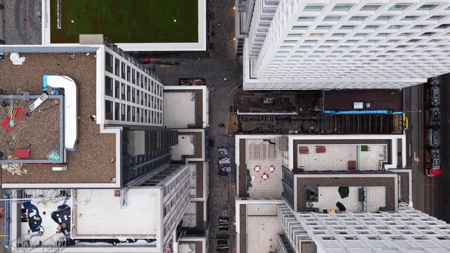 Toronto high rise buildings with green rooftop and street level construction activity revealing modern architectural design of urban canyon in Canada