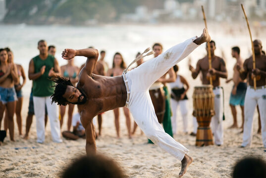 Capoeira athlete performing acrobatic kick on beach in Brazil