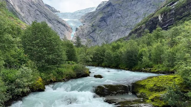 The river flows down from the glacier Briksdalsbreen Norway