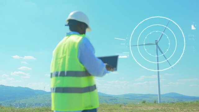 Field operator equipped with high visibility clothing monitoring renewable energy systems in remote locations