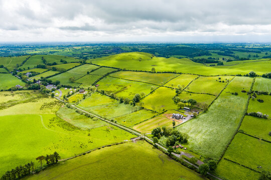 Patchwork fields spread across County Meath, Ireland, under heavy cloud. A peaceful Boyne Valley farming landscape of hedgerows, pasture and rural roads.