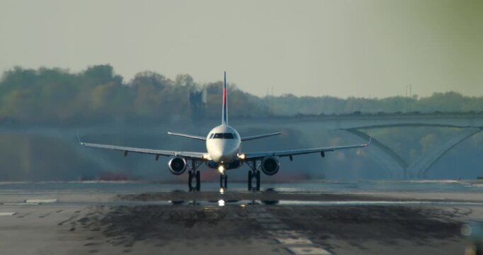 Jet Takes Off with Tree Branches in Foreground