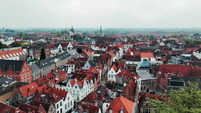 Aerial View of St Walburga Church and Medieval Rooftops at Sunrise in Bruges Belgium