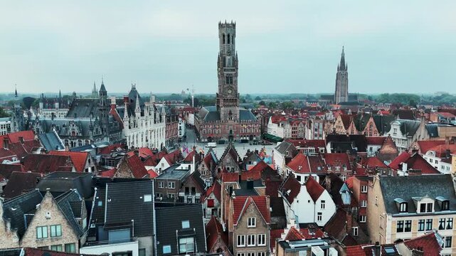 Belfry Tower and Grote Markt Square Aerial Approach in Bruges Belgium