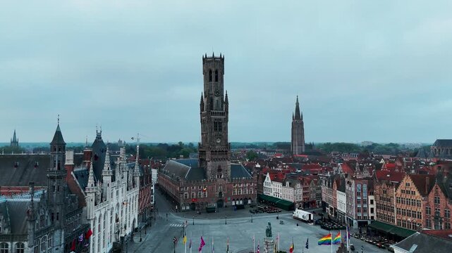 Aerial Orbit of Bruges Belfry and Grote Markt Market Square at Sunrise Belgium