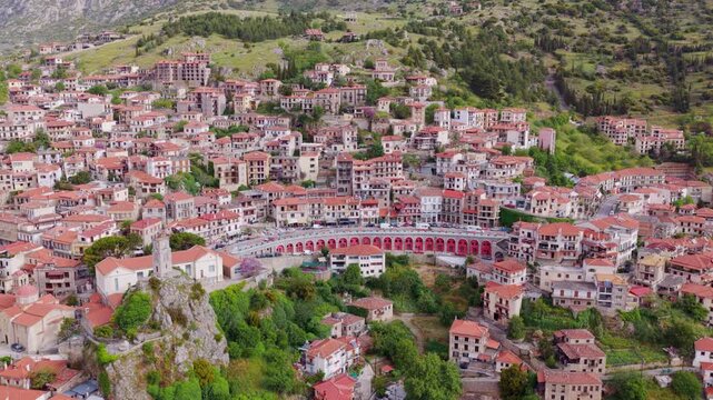 Picturesque aerial view of the beautiful mountain town of Arachova, a famous winter destination located on the slope of mount Parnassus in Boeotia, Greece with traditional stone houses