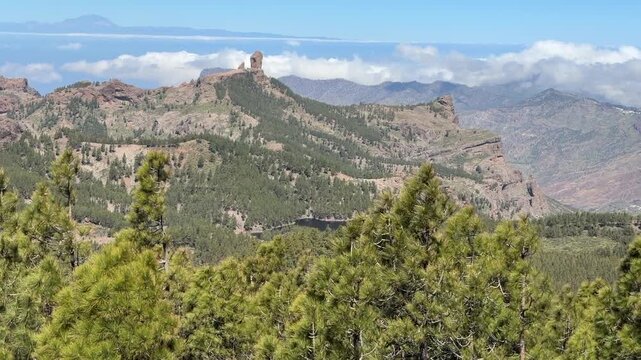 Roque Nublo landscape at Gran Canaria with Mount Teide at far background, and wind moving trees. - May 2026