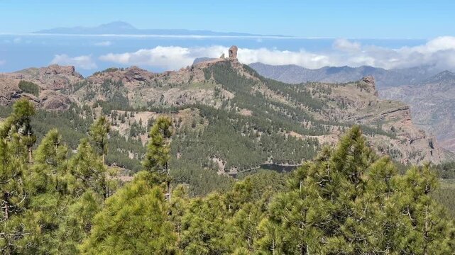 Roque Nublo landscape at Gran Canaria with Mount Teide at far background, and wind moving trees. - May 2026