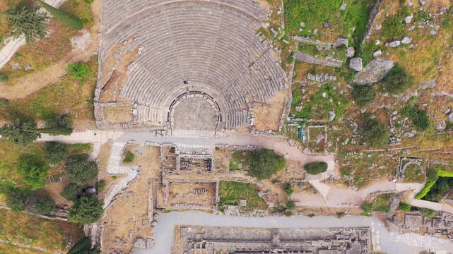 Aerial drone shot showing the magnificent ancient theatre and the temple of Apollo at the archaeological site of Delphi, a famous Unesco world heritage site located in Greece