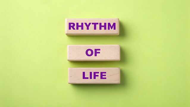 Wooden blocks with rhythm of life on green background
