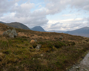 On the West Highland Way on Rannoch Moor at the Black Mount approaching Glencoe in the Scottish Highlands, showing slopes of Meall a' Bhuiridh, Buachaille Etive Mor and Beinn a' Chrulaiste. © David