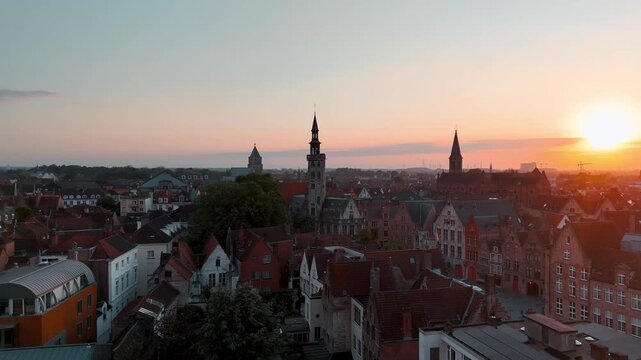 Aerial Orbit of Poortersloge Historic Landmark in Bruges Belgium at Sunset