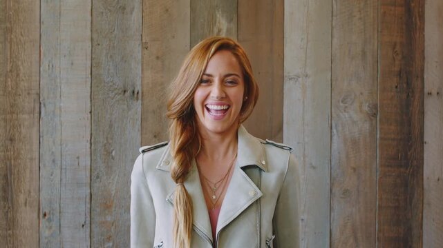 Face, happy and woman with career, job and friendly for advisor at realtor opportunity. Smile, laughing and professional with real estate agent or person for about us or property on wall background