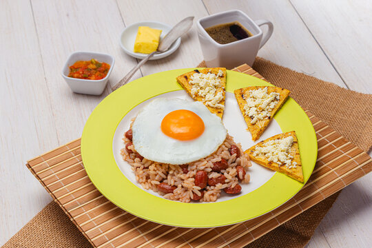 Colombian Calentado Breakfast with Fried Egg, Arepa, Hogao and Tinto Coffee